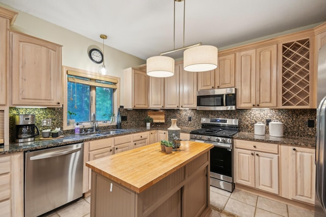 342 Soo Line Rd, Troy Twp, WI 54016 - kitchen with appliances with stainless steel finishes, wooden counters, light brown cabinets, and a sink