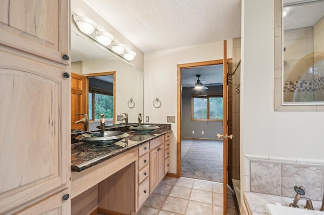 342 Soo Line Rd, Troy Twp, WI 54016 - full bathroom featuring double vanity, a bath, a textured ceiling, a ceiling fan, and tiled shower