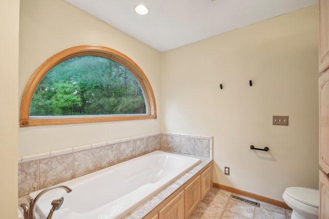 342 Soo Line Rd, Troy Twp, WI 54016 - full bath featuring a bath, toilet, tile patterned floors, and baseboards