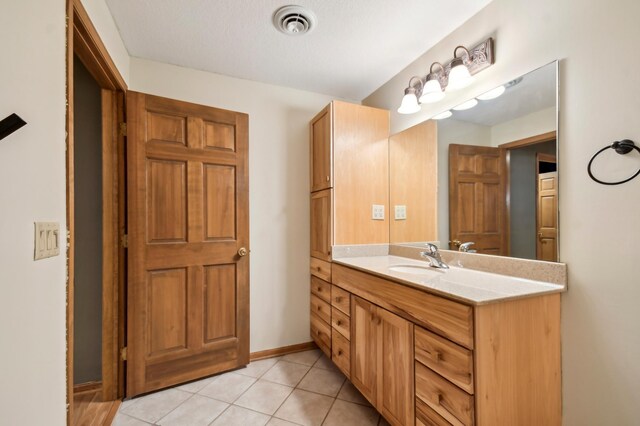 342 Soo Line Rd, Troy Twp, WI 54016 - bathroom featuring vanity, tile patterned flooring, and baseboards