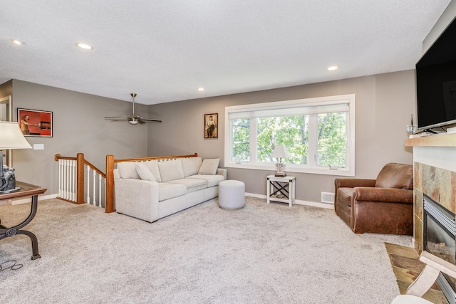 1709 140th St, Burnsville, MN 55337 - living area with a tile fireplace, carpet floors, recessed lighting, baseboards, and ceiling fan