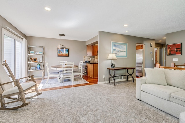 1709 140th St, Burnsville, MN 55337 - living room with light colored carpet, recessed lighting, and baseboards
