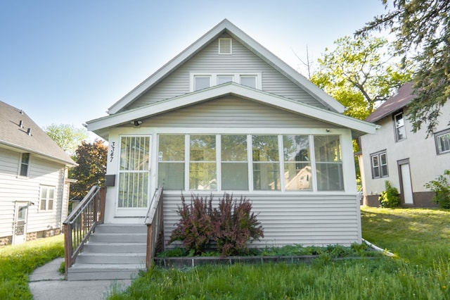 view of front of house with a sunroom