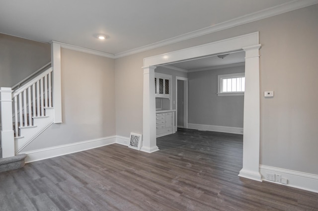 unfurnished room with stairs, baseboards, dark wood-style floors, and ornamental molding