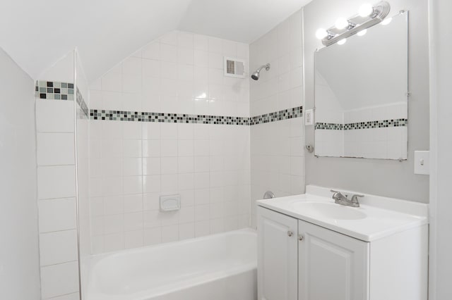188 Wyoming St E, Saint Paul, MN 55107 - full bathroom featuring vaulted ceiling, shower / bathtub combination, and vanity