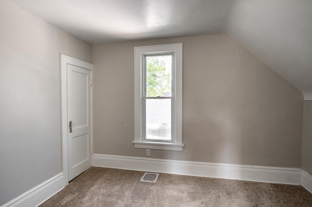 188 Wyoming St E, Saint Paul, MN 55107 - additional living space with carpet, vaulted ceiling, and baseboards