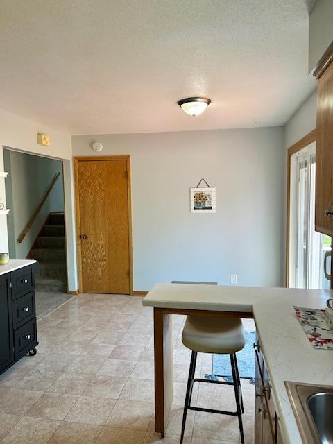 dining room featuring stairway