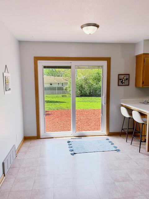 7731 80th St S, Cottage Grove, MN 55016 - doorway with healthy amount of natural light
