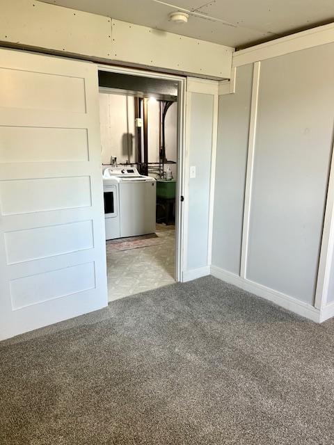 7731 80th St S, Cottage Grove, MN 55016 - spare room featuring washer and clothes dryer, light carpet, and a smoke detector
