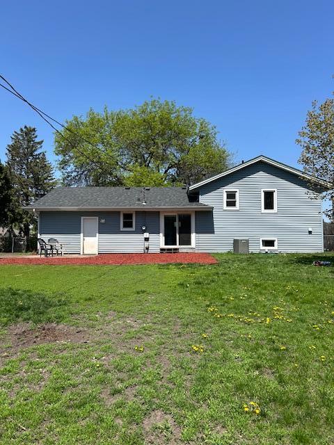 7731 80th St S, Cottage Grove, MN 55016 - rear view of house with a lawn