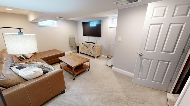 711 3rd St SE, Willmar, MN 56201 - living area featuring light carpet, baseboards, plenty of natural light, and recessed lighting