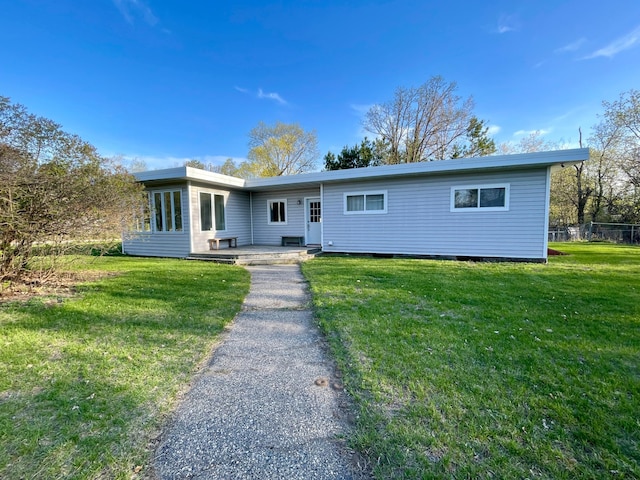 ranch-style house featuring a front yard