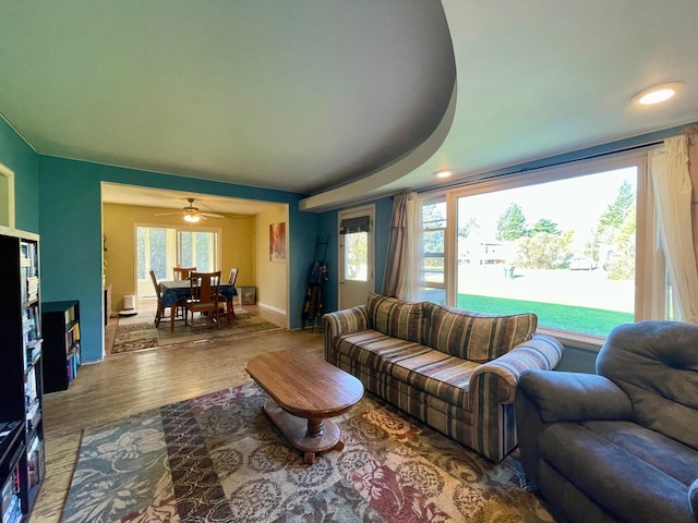 living room featuring wood finished floors and baseboards