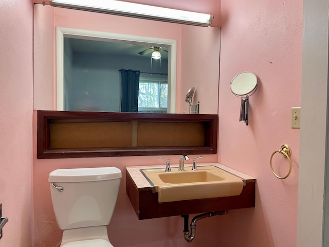bathroom with toilet and a ceiling fan