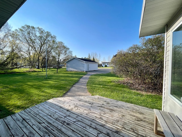 wooden deck featuring a lawn