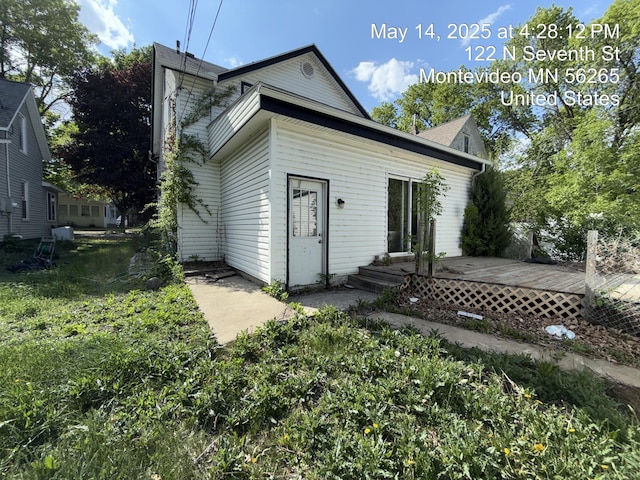 122 7th St, Montevideo, MN 56265 - rear view of property featuring a wooden deck