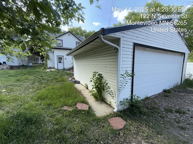 122 7th St, Montevideo, MN 56265 - view of property exterior featuring a garage and an outbuilding