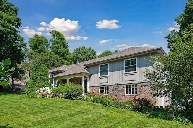 18120 Hummingbird Rd, Deephaven, MN 55391 - view of front of home with a front yard