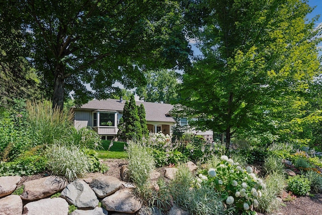 18120 Hummingbird Rd, Deephaven, MN 55391 - view of front facade featuring a shingled roof