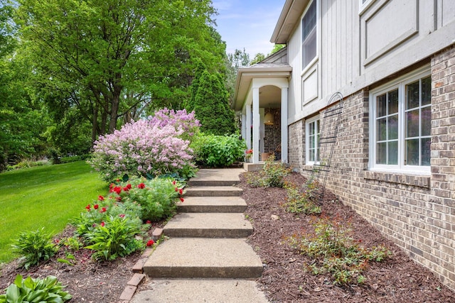 18120 Hummingbird Rd, Deephaven, MN 55391 - entrance to property with a yard and brick siding
