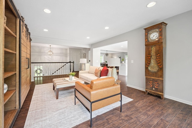 18120 Hummingbird Rd, Deephaven, MN 55391 - living room featuring dark wood-style flooring, recessed lighting, a chandelier, and baseboards