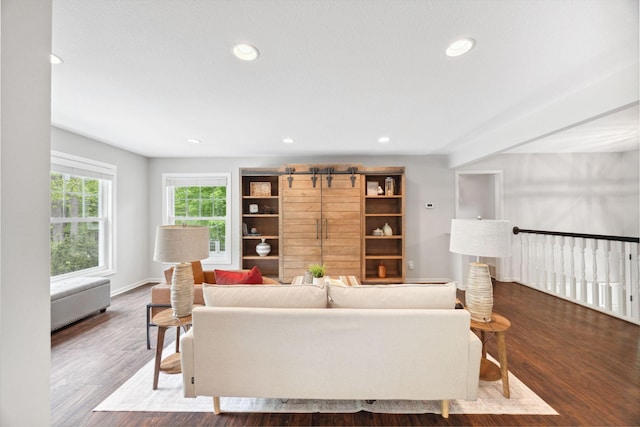 18120 Hummingbird Rd, Deephaven, MN 55391 - living room with wood finished floors, recessed lighting, and baseboards