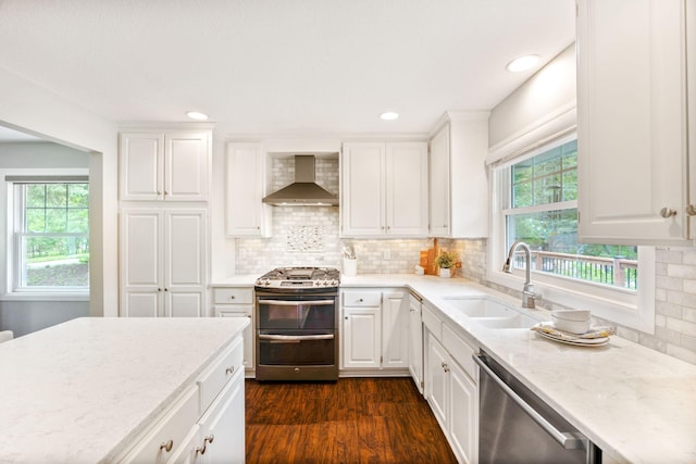 18120 Hummingbird Rd, Deephaven, MN 55391 - kitchen featuring wall chimney exhaust hood, stainless steel appliances, a sink, plenty of natural light, and recessed lighting