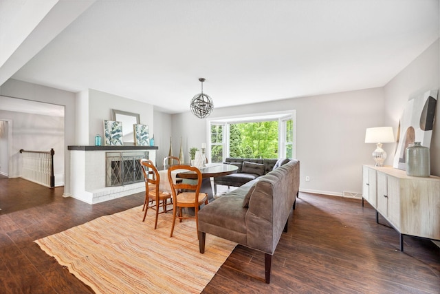 18120 Hummingbird Rd, Deephaven, MN 55391 - living area featuring wood finished floors, baseboards, and a chandelier