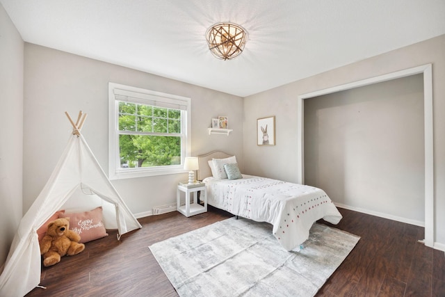 18120 Hummingbird Rd, Deephaven, MN 55391 - bedroom featuring baseboards and dark wood-style floors