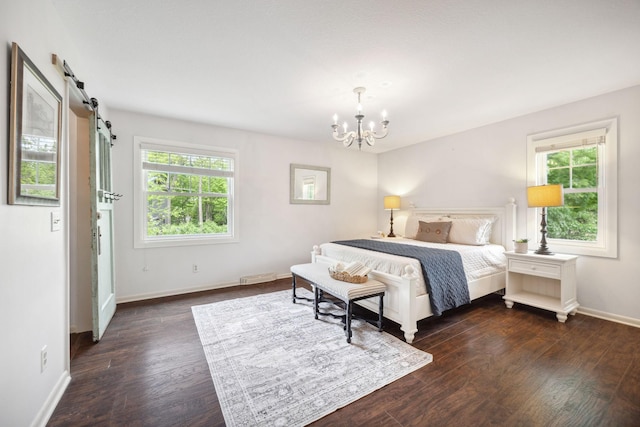18120 Hummingbird Rd, Deephaven, MN 55391 - bedroom featuring a chandelier, multiple windows, baseboards, and a barn door