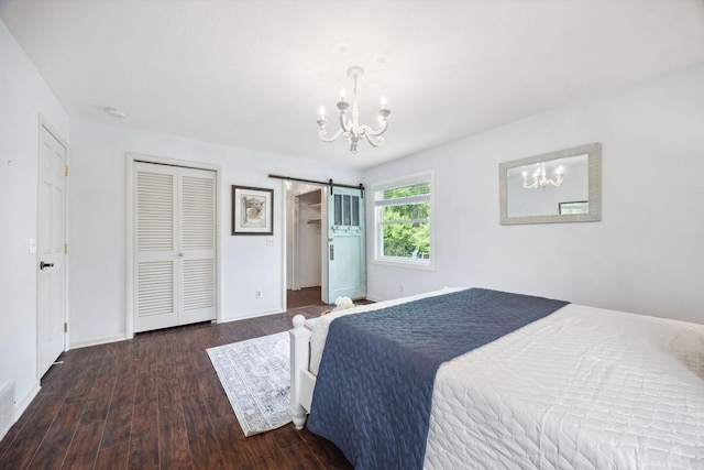 18120 Hummingbird Rd, Deephaven, MN 55391 - bedroom featuring a chandelier, wood finished floors, a barn door, and baseboards