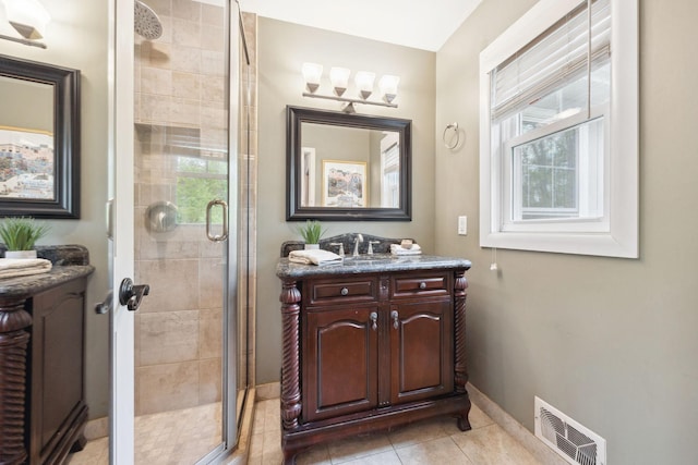 18120 Hummingbird Rd, Deephaven, MN 55391 - full bath featuring a stall shower, tile patterned floors, vanity, and baseboards