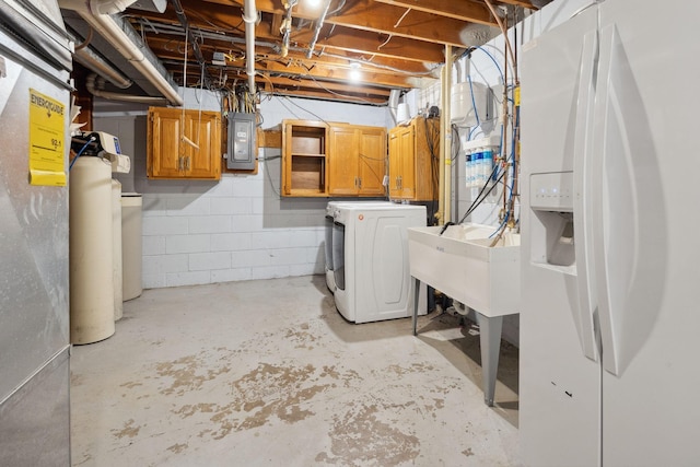 18120 Hummingbird Rd, Deephaven, MN 55391 - unfinished basement featuring washer / clothes dryer, white fridge with ice dispenser, electric panel, concrete block wall, and a sink