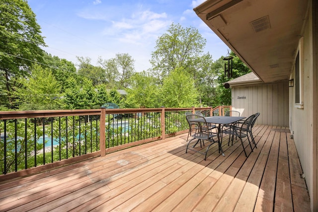 18120 Hummingbird Rd, Deephaven, MN 55391 - wooden deck with outdoor dining area