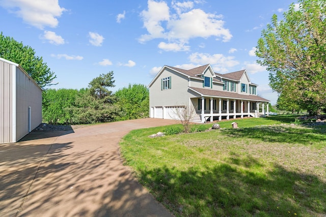 5230 Rebecca Park Trl, Greenfield, MN 55357 - view of property exterior with an attached garage, concrete driveway, covered porch, and a lawn
