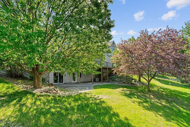 5230 Rebecca Park Trl, Greenfield, MN 55357 - view of grassy yard featuring a patio area