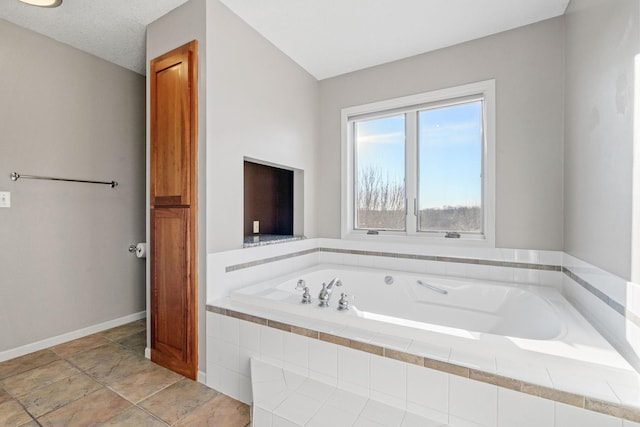 5230 Rebecca Park Trl, Greenfield, MN 55357 - bathroom with a bath and baseboards