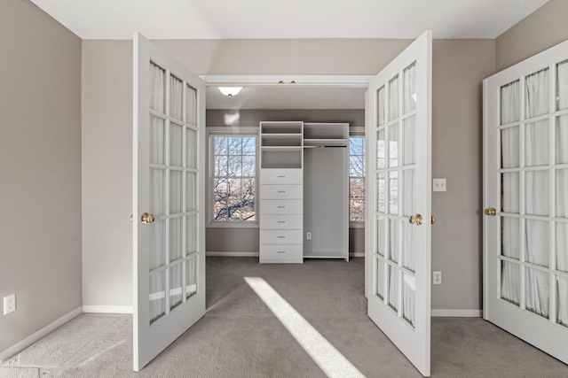 5230 Rebecca Park Trl, Greenfield, MN 55357 - walk in closet with french doors and carpet flooring
