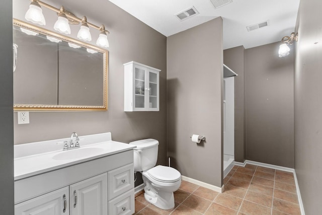 5230 Rebecca Park Trl, Greenfield, MN 55357 - bathroom with toilet, vanity, walk in shower, tile patterned flooring, and baseboards