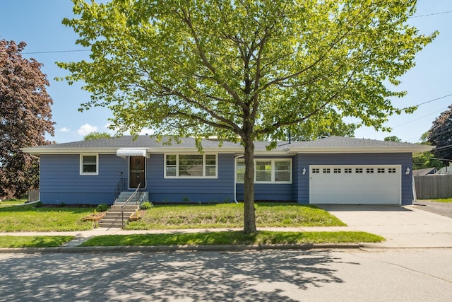 343 41st St, Minneapolis, MN 55409 - ranch-style house featuring a garage and driveway