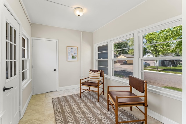 343 41st St, Minneapolis, MN 55409 - sitting room with healthy amount of natural light, baseboards, and light tile patterned floors