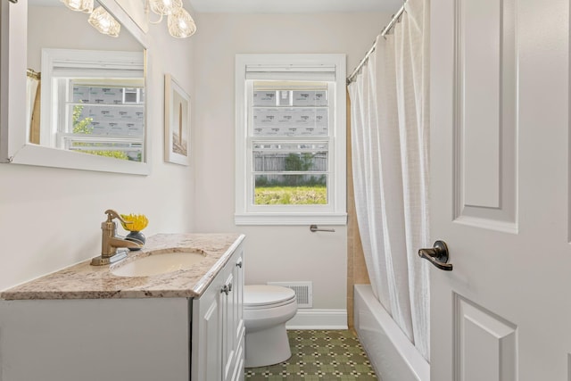 343 41st St, Minneapolis, MN 55409 - full bathroom with vanity, toilet, shower / bath combination with curtain, and tile patterned flooring