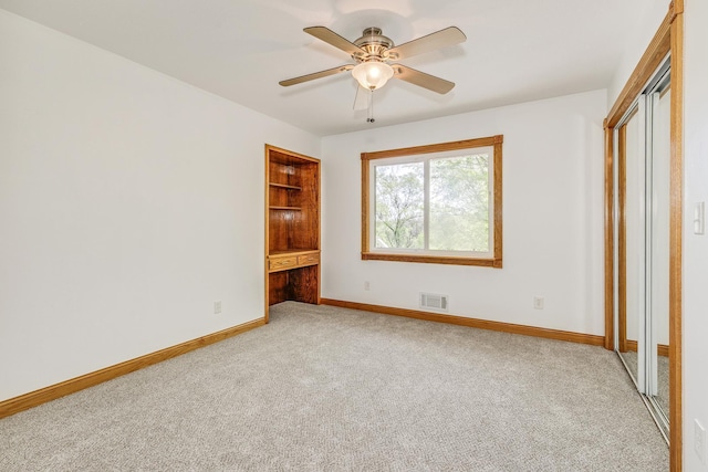 2000 191st Ave NW, Oak Grove, MN 55011 - unfurnished bedroom featuring light colored carpet, baseboards, and ceiling fan