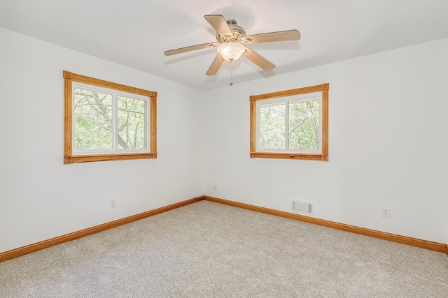 2000 191st Ave NW, Oak Grove, MN 55011 - empty room featuring healthy amount of natural light, carpet flooring, baseboards, and ceiling fan