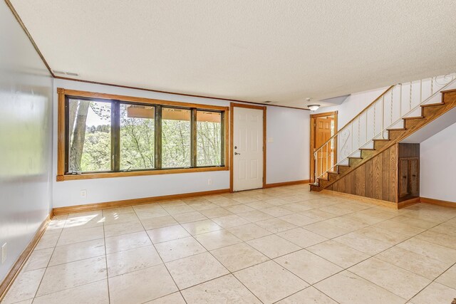2000 191st Ave NW, Oak Grove, MN 55011 - empty room featuring stairway, baseboards, a textured ceiling, and light tile patterned floors