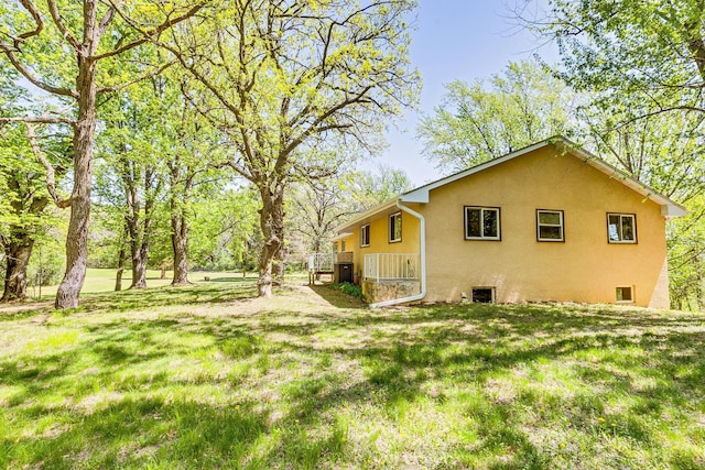 2000 191st Ave NW, Oak Grove, MN 55011 - view of home's exterior featuring stucco siding and a yard