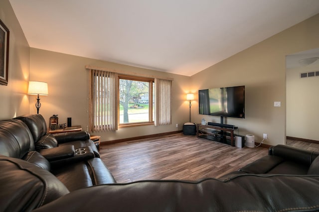 791 Highland Rd, Windom, MN 56101 - living room with vaulted ceiling, wood finished floors, and baseboards