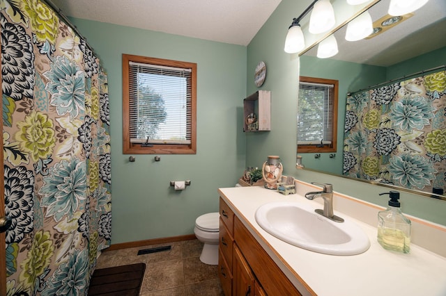 791 Highland Rd, Windom, MN 56101 - bathroom featuring toilet, baseboards, vanity, and tile patterned flooring