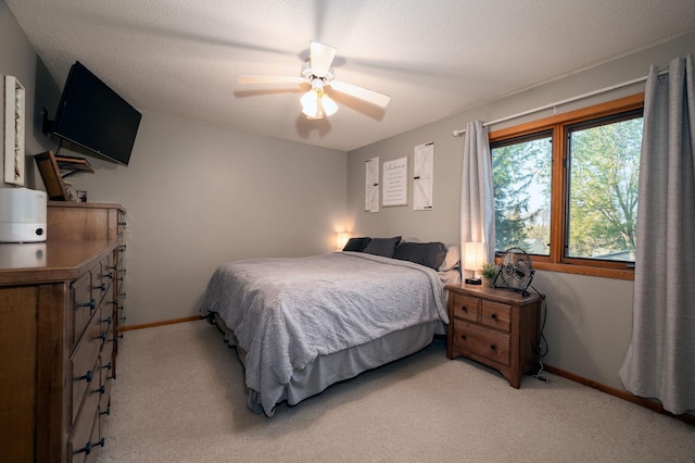 791 Highland Rd, Windom, MN 56101 - bedroom with light carpet, baseboards, and ceiling fan