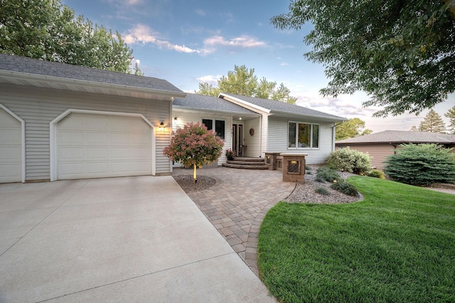 791 Highland Rd, Windom, MN 56101 - ranch-style house featuring concrete driveway, an attached garage, and a front yard